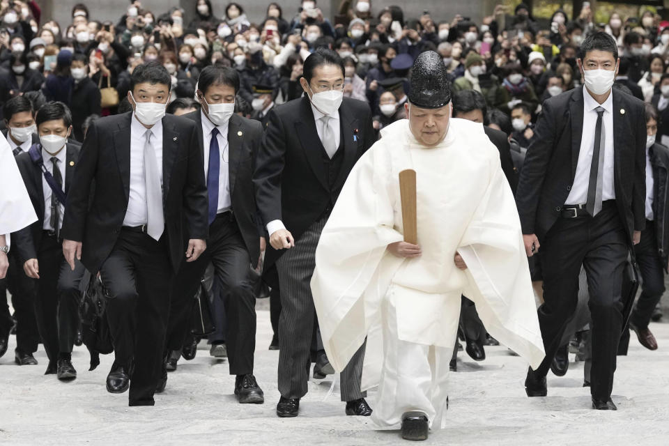 Japan's Prime Minister Fumio Kishida, center, visits Ise Jingu shrine in Ise, central Japan Wednesday, Jan. 4, 2023. (Kyodo News via AP)