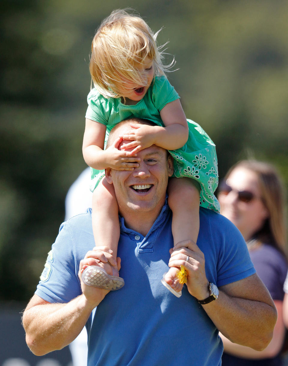 RIDES ON DAD'S SHOULDERS