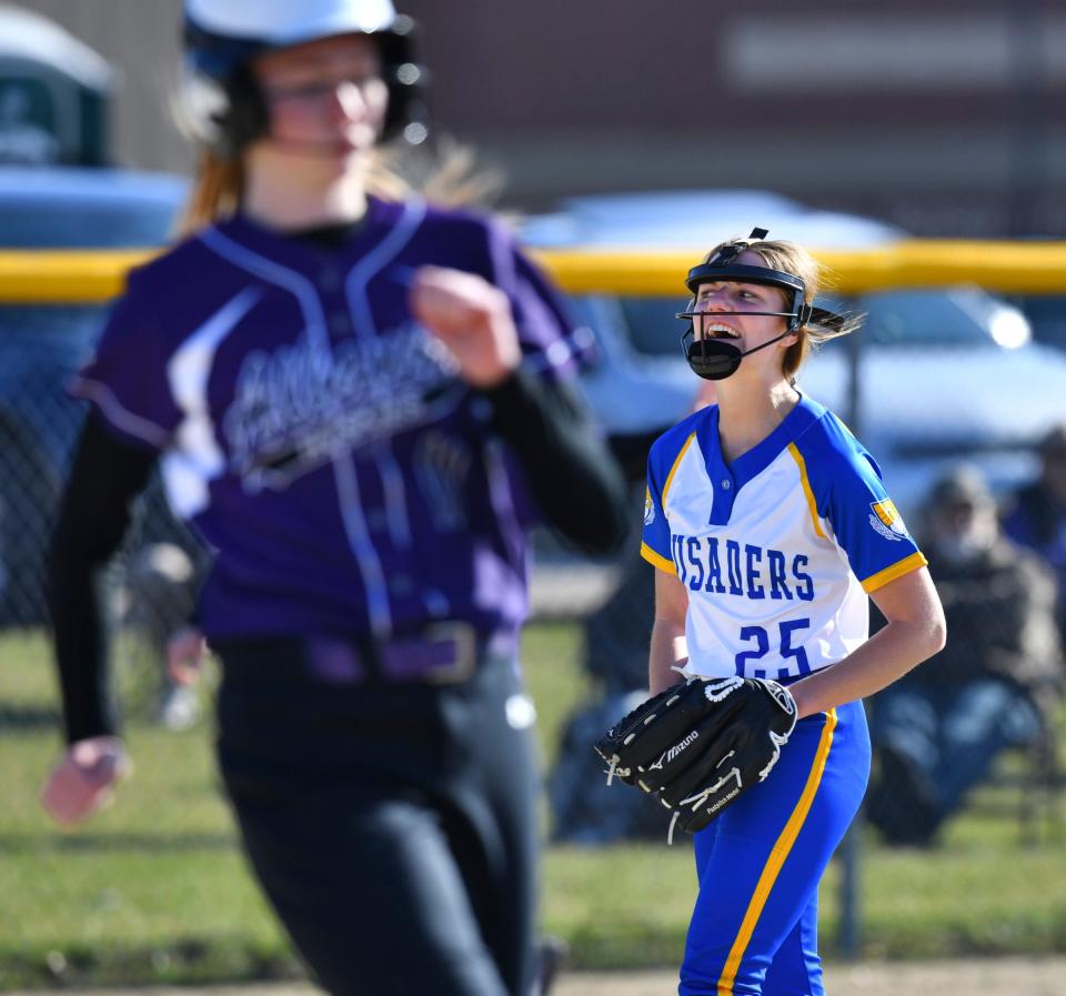 Ella Voit of Cathedral celebrates her team's win at the end of the first game of a double header Tuesday, May 3, 2022, at Albany High School. 