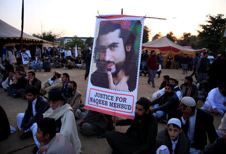 A member of the Pashtun community holds a picture of Naqibullah Mehsud, whose extrajudicial killing by Karachi police sparked nationwide protests, as he gathers with others to protest against what they say are enforced “disappearances” and routine oppression, in Islamabad, Pakistan February 1, 2018. REUTERS/Faisal Mahmood