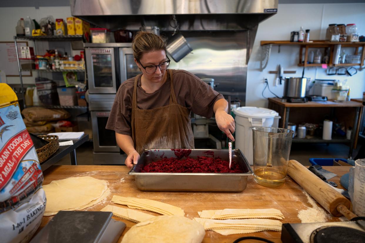 Emily Kalisek mixes pie filling at Me Oh My Coffee and Pie's Loveland, Colo., location, 280 East 29th St., on Oct. 04, 2023.