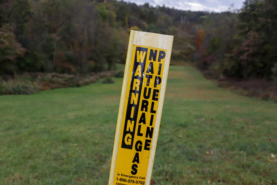 In this Oct. 17, 2019, photo, a post marks the location of a shale gas pipeline in Zelienople, Pa. President Donald Trump has aligned with Pennsylvania's natural gas industry, but his support for the industry in the nation's No. 2 natural gas state may not yield the expected political boost in what is perhaps the nation's premier presidential battleground state. In parts of the state critical to his path to victory, opposition to fracking is growing and calls for getting tough on the industry are popular. (AP Photo/Keith Srakocic)