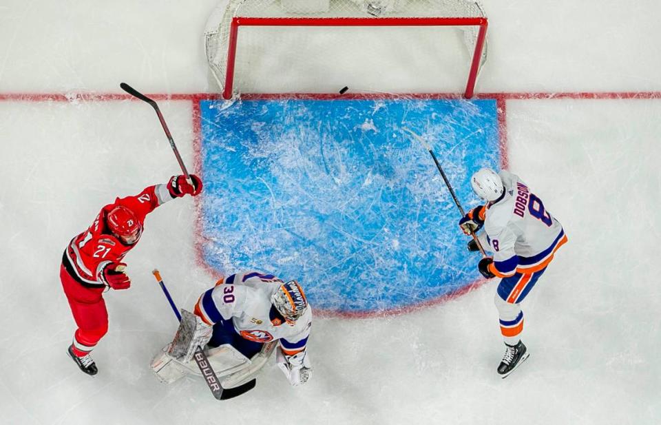 The Carolina Hurricanes Derek Stepan (21) reacts after a goal by teammate Paul Stastny (26) on New York Islanders goalie Ilya Sorokin (30) in the second period during Game 5 of their Stanley Cup series on Tuesday, April 25, 2023 at PNC Arena in Raleigh, N.C.