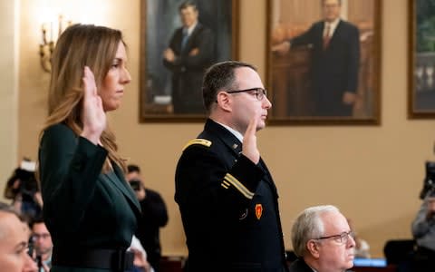 Jennifer Williams and Lt Col Alexander Vindman were sworn in on Capitol Hill on Tuesday - Credit: MICHAEL REYNOLDS/EPA-EFE/REX