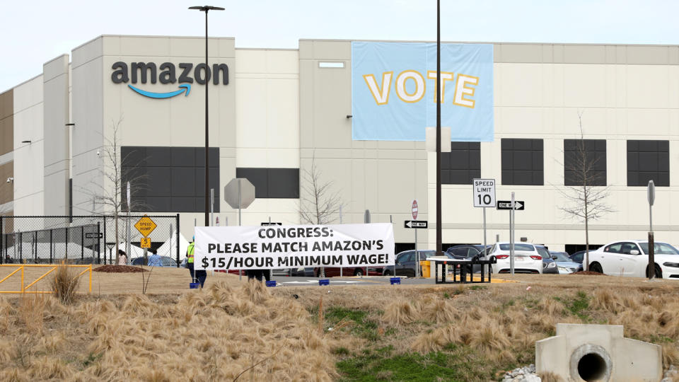 Banners at the Amazon facility in Bessemer, Ala., in March to show their support for workers who will vote on whether to unionize. (Dustin Chambers/Reuters)