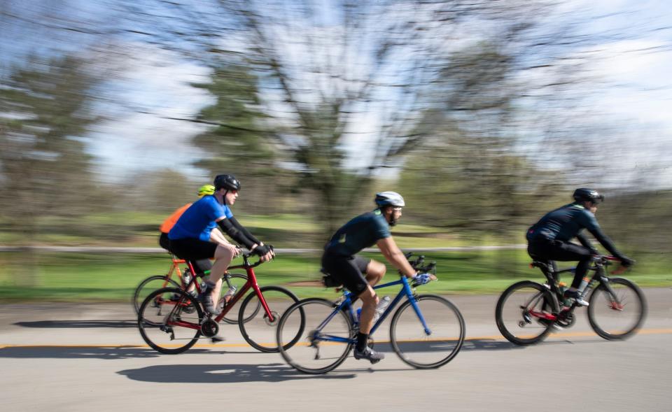 Cyclists make their way to the top of Cherokee Park in Louisville, Kentucky for the annual Tour de Lou ride. April 16, 2022