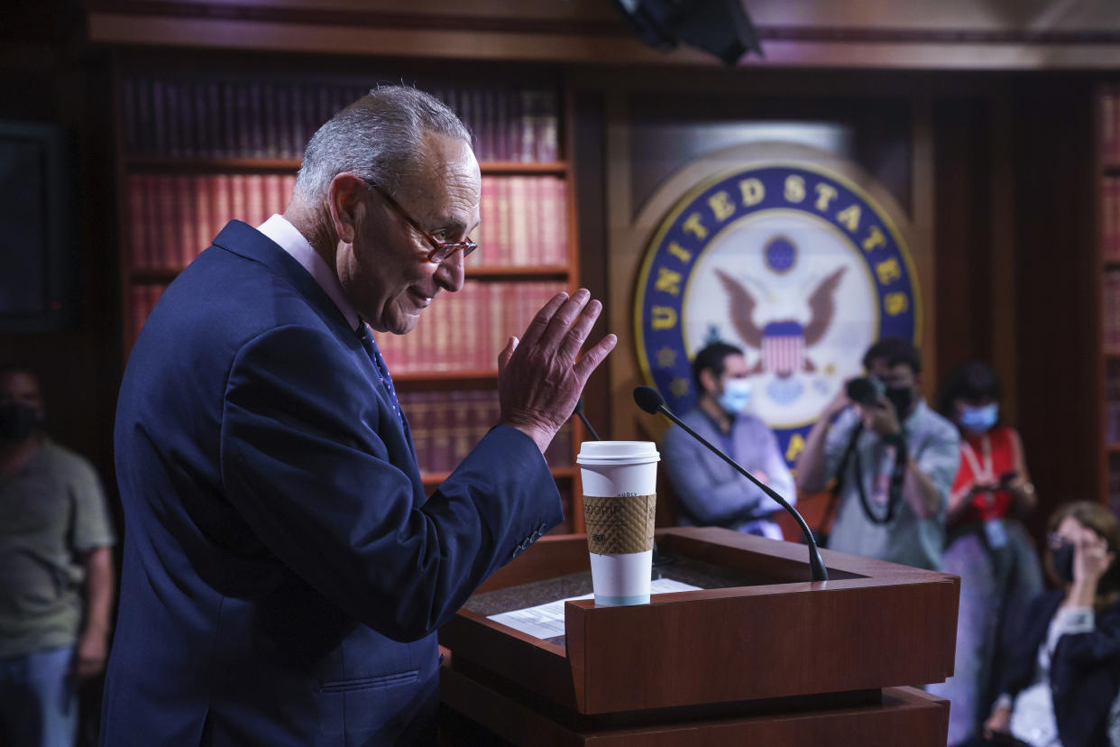 Senate Majority Leader Chuck Schumer, D-N.Y., meets with reporters after a marathon 