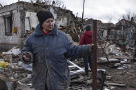 Inna, 71, stands outside of her house which was destroyed by a Russian drone attack in a residential neighbourhood, in Zaporizhzhia, Ukraine, on Thursday, March 28, 2024. (AP Photo/Andriy Andriyenko)