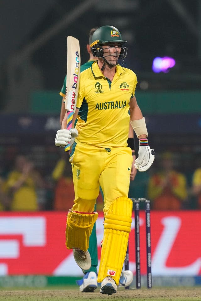 Pat Cummins celebrates after hitting the winning runs 