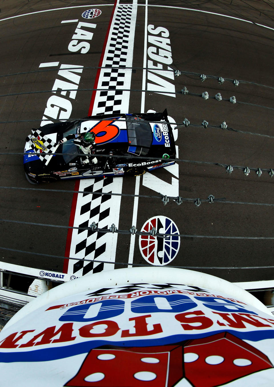 LAS VEGAS, NV - MARCH 10: Ricky Stenhouse Jr., driver of the #6 Ford EcoBoost Ford, celebrates with the checkered flag after winning the NASCAR Nationwide Series Sam's Town 300 at Las Vegas Motor Speedway on March 10, 2012 in Las Vegas, Nevada. (Photo by Tom Pennington/Getty Images)