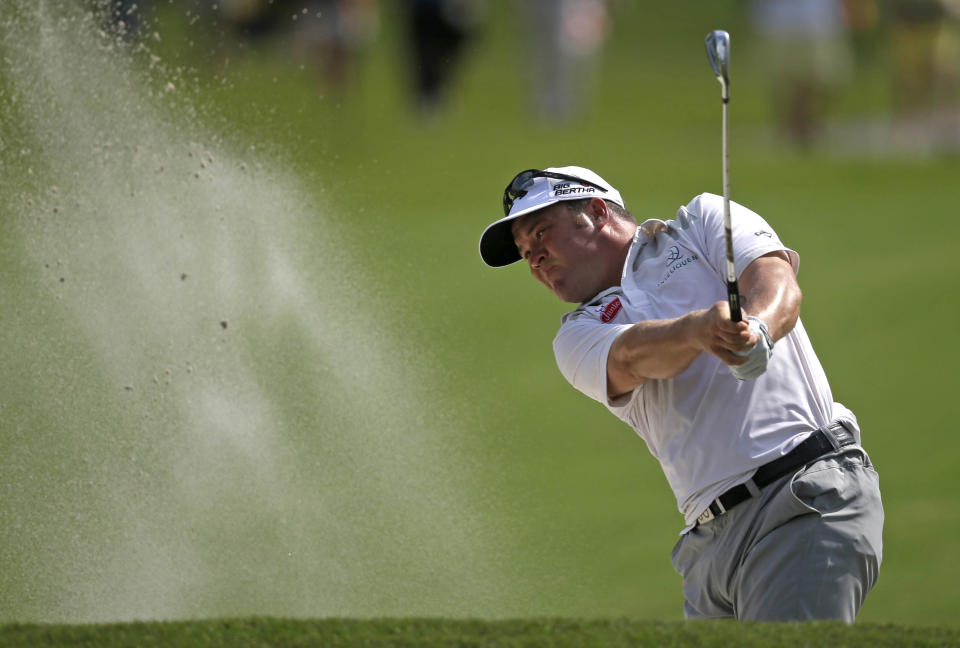 Andrew Svboda hits out of the sand onto the 18th green during the second round of the Zurich Classic golf tournament at TPC Louisiana in Avondale, La., Friday, April 25, 2014. (AP Photo/Gerald Herbert)