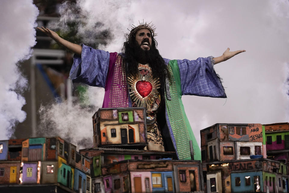 A performer from the Mangueira samba school parades during Carnival celebrations at the Sambadrome in Rio de Janeiro, Brazil, Monday, Feb. 24, 2020. (AP Photo/Leo Correa)