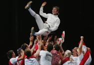 Timea Nagy of Hungary is thrown in the air to celebrate winning the gold medal in the women's fencing individual epee gold medal match on August 15, 2004 during the Athens 2004 Summer Olympic Games at Helliniko Olympic Complex Fencing Hall in Athens, Greece. (Photo by Jamie Squire/Getty Images)