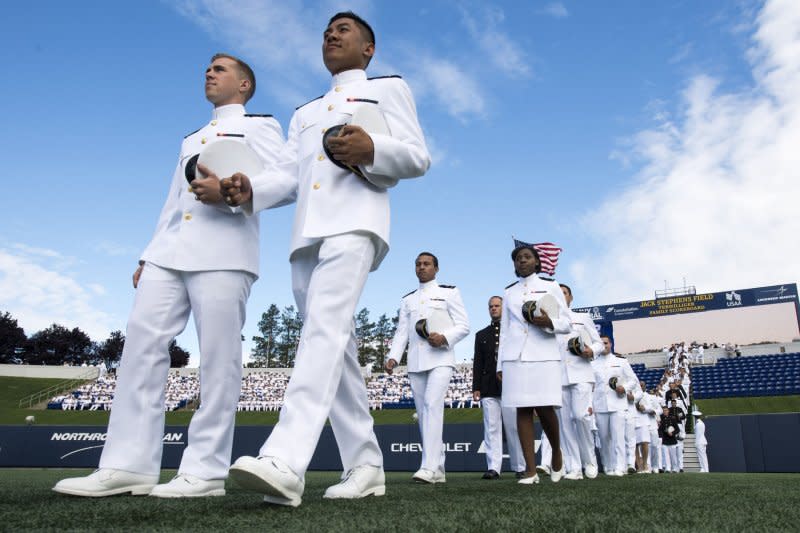 Graduating midshipmen arrive for the graduation and commissioning ceremony at the U.S. Naval Academy in Annapolis, Md. on May 26, 2017. On July 26, 1948, President Harry S. Truman ordered desegregation of the U.S. military. File Photo by Kevin Dietsch/UPI