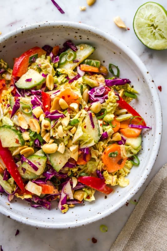 <p>Simple Veganista</p><p> Cool cucumbers, crunchy carrots, red bell peppers and Napa cabbage tossed together with a delicious citrus peanut dressing.</p><p><strong>Get the recipe:</strong> <a href="https://simple-veganista.com/cucumber-salad-peanut-citrus-dressing/" rel="nofollow noopener" target="_blank" data-ylk="slk:Thai Crunch Salad;elm:context_link;itc:0;sec:content-canvas" class="link ">Thai Crunch Salad</a></p>