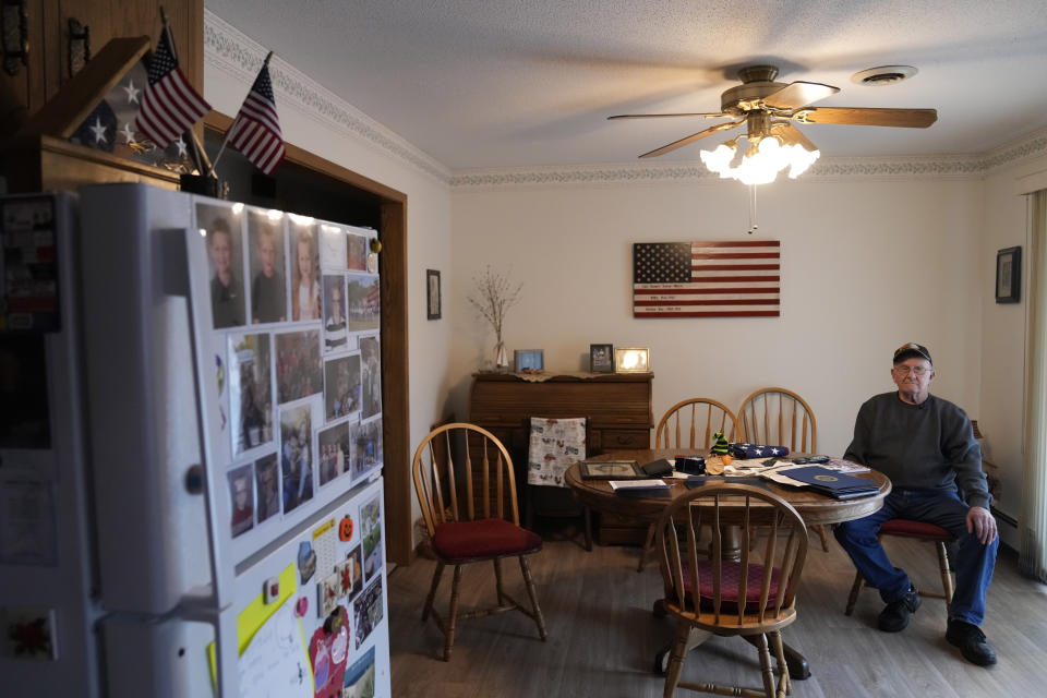 FILE - Earl Meyer, who fought for the U.S. Army in the Korean War, sits with war memorabilia at his home, Nov. 7, 2023, in St. Peter, Minn. On Monday, April 22, 2024, the U.S. Army notified Meyer, who still carries shrapnel in his leg from when he was wounded in combat, that he will finally get his Purple Heart medal, 73 years late. (AP Photo/Abbie Parr, File)