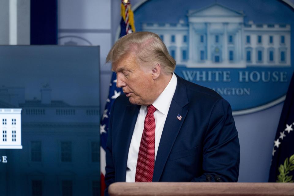 President Donald Trump leaves a news conference in the James Brady Press Briefing Room at the White House, Monday, Aug. 10, 2020, in Washington. (AP Photo/Andrew Harnik)