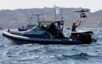 FILE PHOTO: A man launches a drone during the day one of the SailGP event in Marseille