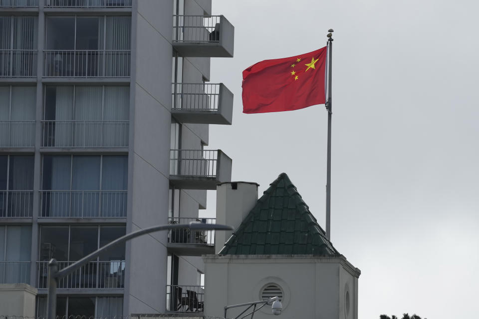 The five-star Red Flag flies over the Chinese consulate in San Francisco, Tuesday, Oct. 10, 2023. A car rammed into the consulate in San Francisco on Monday, coming to a stop in the lobby and creating a chaotic scene that ended with police shooting the driver, who later died at the hospital, officials said. (AP Photo/Eric Risberg)