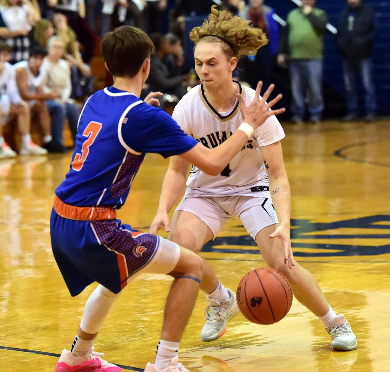 Elmira Notre Dame's Jeremiah Parker controls the ball as Thomas A. Edison's Andrew Slaven defends during the Crusaders' 65-36 win in boys basketball Dec. 8, 2023 at Notre Dame High School.
