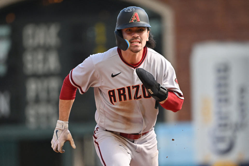 Oct 1, 2022; San Francisco, California, USA; Arizona Diamondbacks center fielder Corbin Carroll (7) takes a lead at second base against the San Francisco Giants during the sixth inning at Oracle Park. Mandatory Credit: Robert Edwards-USA TODAY Sports