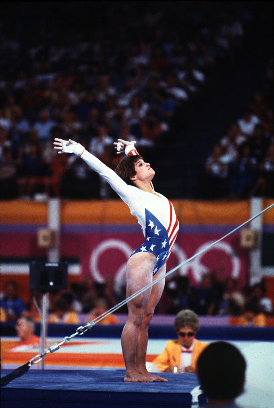 Action shot of Mary Lou Retton  competing in 1984 Olympics.