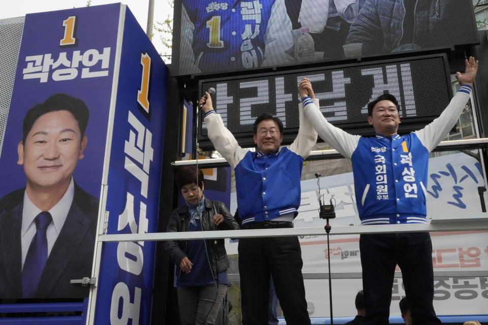 South Korea's main opposition Democratic Party leader Lee Jae-myung, left, reacts with his party's candidate Kwak Sang-eon during a campaign rally for the upcoming parliamentary election on April 10, in Seoul, South Korea, Monday, April 8, 2024. As South Koreans head to the polls to elect a new 300-member parliament on this week, many are choosing their livelihoods and other domestic concerns as the most important election issues. It's in a stark contrast from past elections that were overshadowed by security and foreign policy issues like North Korean nuclear threats and U.S. security commitment for South Korea.(AP Photo/Ahn Young-joon)