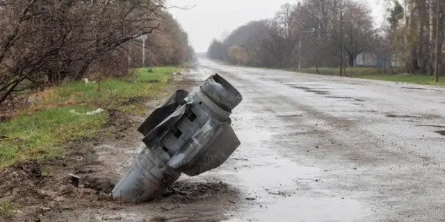 An unexploded rocket from Russia lays in the road