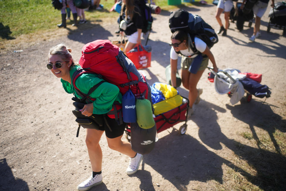 People arrive on the first day of the Glastonbury Festival at Worthy Farm in Somerset. Picture date: Wednesday June 22, 2022.