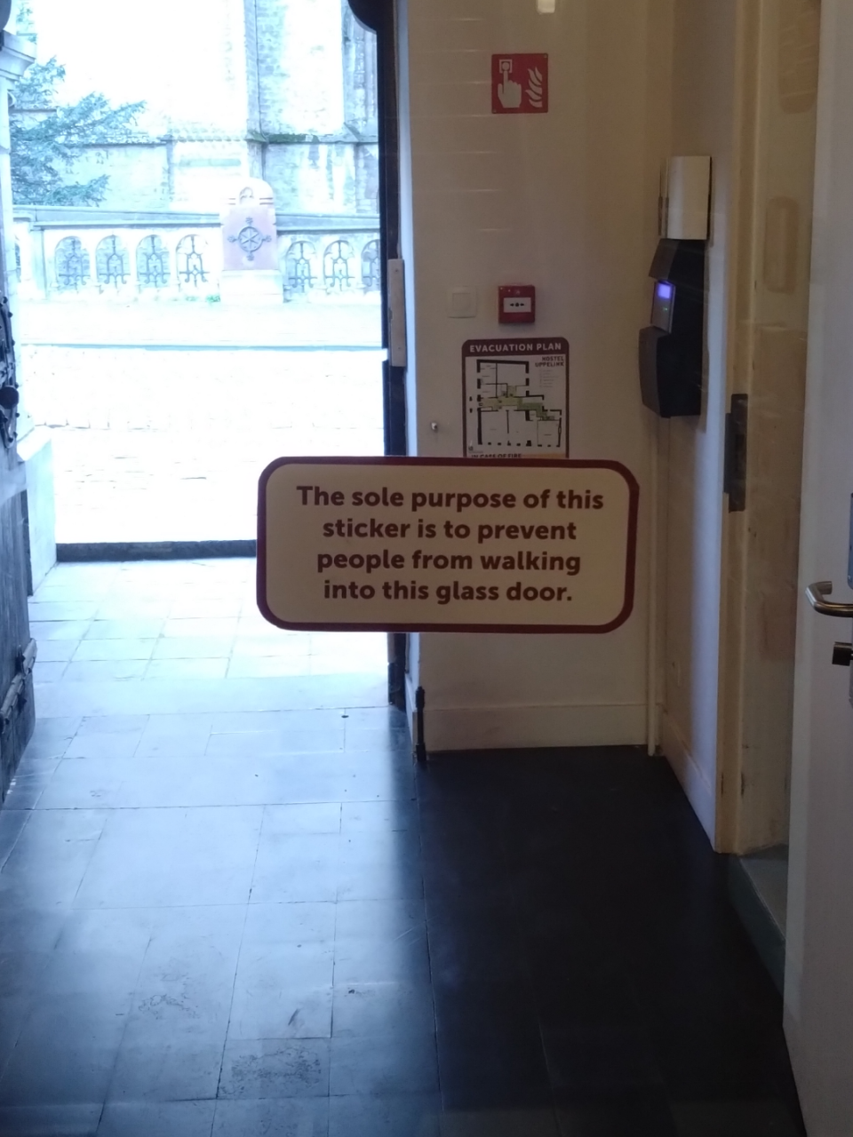 "The sole purpose of this sticker is to prevent people from walking into this glass door."