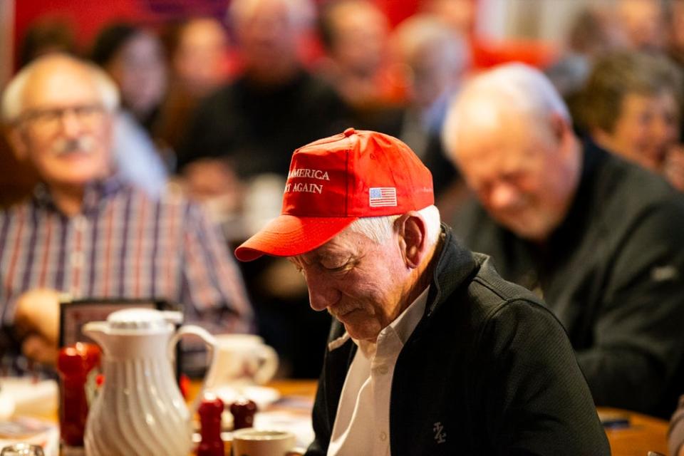 Members of the Westside Conservative Club listen to a debate among three candidates running in the Republican primary to represent Iowa's 3rd Congressional District on Wednesday, April 27, 2022, at the Machine Shed in Urbandale, Iowa.