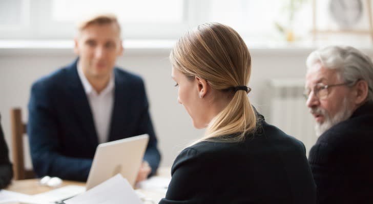 A woman looks over the family limited partnership (FLP) agreement that her family has drafted.