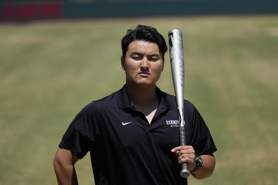 Rintaro Sasaki poses for photos at the Sunken Diamond baseball field at Stanford University in Stanford, Calif., Friday, May 31, 2024. Slugging first baseman Sasaki hit 140 high school home runs back home in Japan and opted out of the Nippon Professional Baseball draft in order to take his own unique path. He is attending college in the U.S. and will be beginning his summer ball this week in New Jersey playing for Trenton of the MLB Draft League. (AP Photo/Jeff Chiu)