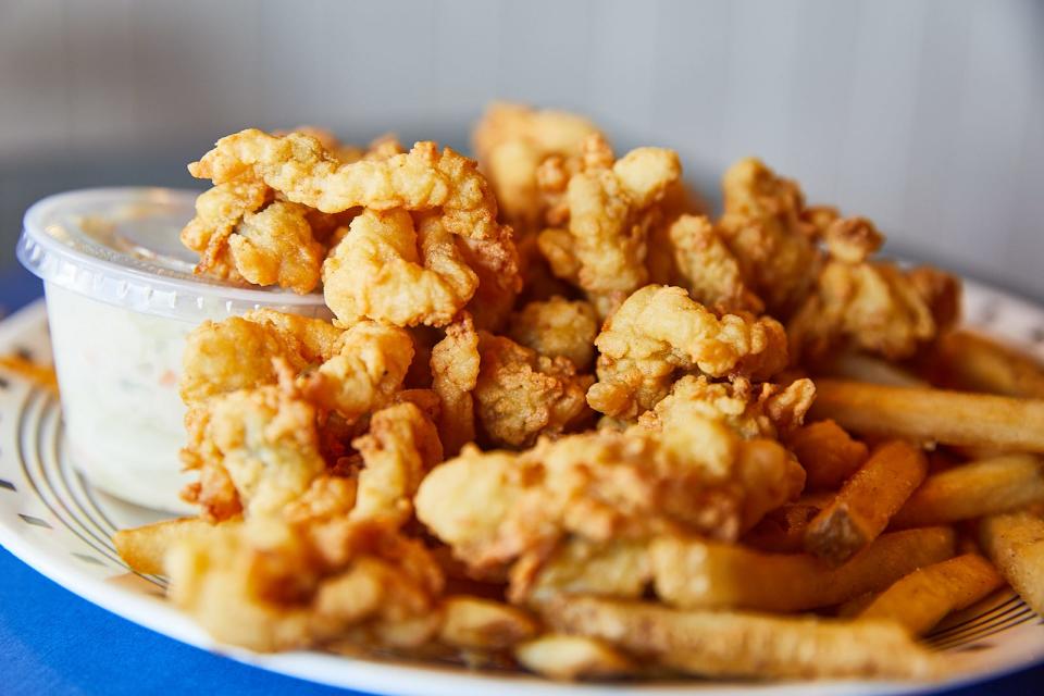 Seafood Sam's Fried Whole Belly Clam Platter is served with cole slaw and fries. The restaurant has been sourcing  clams from the Kneeland family for 50 years.