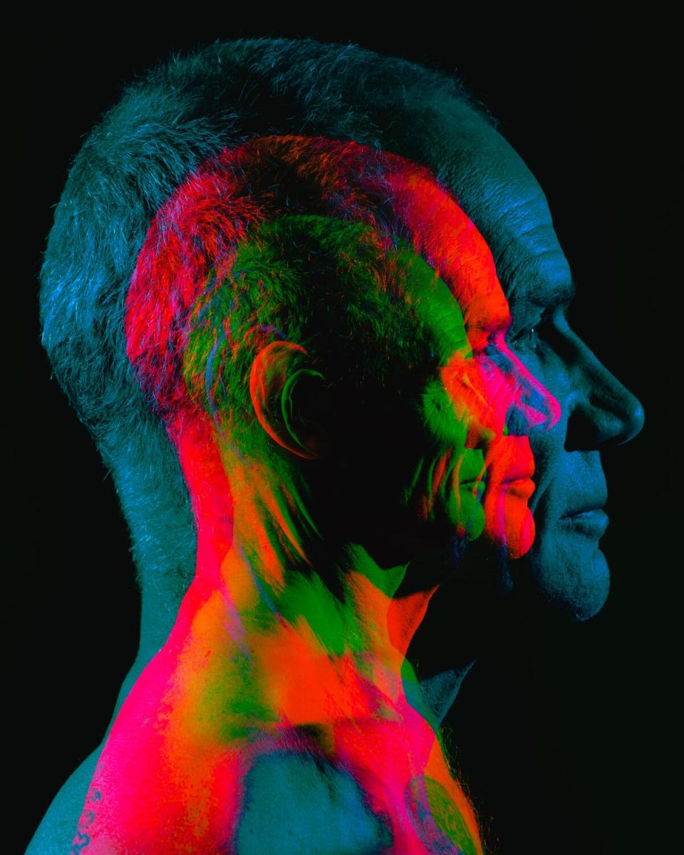 A photo of Flea of the Red Hot Chili Peppers exposed in three colors.