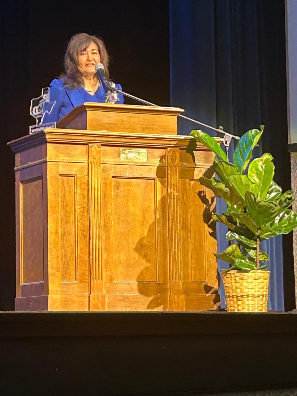 Honoree Sandra Whitlow speaks at the Palo Duro High School Don Hall of Fame induction event held Thursday.
