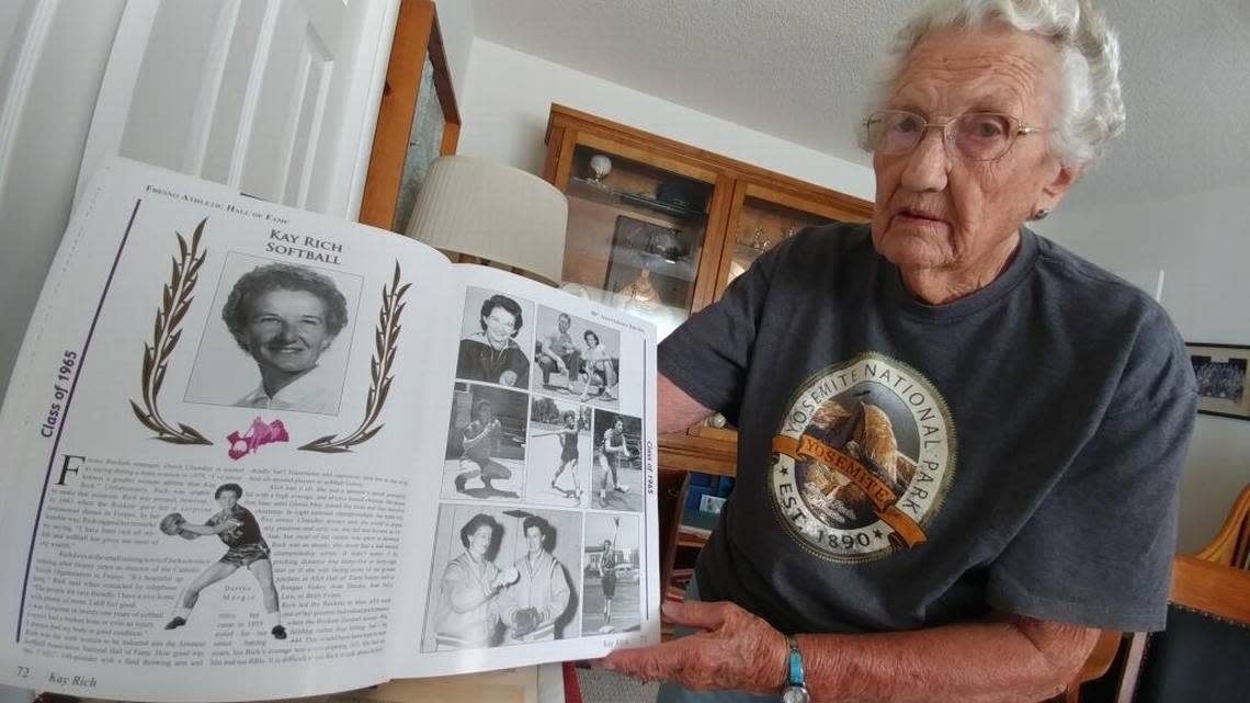 Former Fresno Rockets softball player, Jeanne Contel, pictured here on July 10, 2017, holds the Fresno County Athletic Hall of Fame book where her former teammate and double Hall of Famer Kay Rich is honored. Contel said Rich was the best softball player she had ever seen.