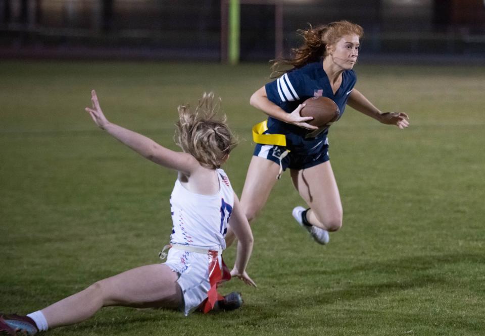 Meredith Pugh (7) makes a move to slip past Emily Good (17) as she gains a chuck of yards during the Pace vs Gulf Breeze flag football at Gulf Breeze High School on Wednesday, March 22, 2023.
