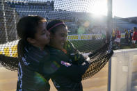 Fernanda Torres, left, hugs Daniela Silva before Mexico played against Denmark at the Homeless World Cup, Tuesday, July 11, 2023, in Sacramento, Calif. (AP Photo/Godofredo A. Vásquez)