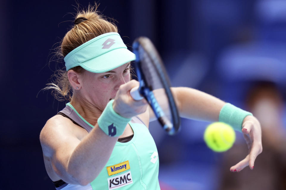 Despina Papamichail of Greece returns a shot against Garbine Muguruza of Spain during a singles match in the Pan Pacific Open tennis tournament at Ariake Colosseum Wednesday, Sept. 21, 2022, in Tokyo. (AP Photo/Eugene Hoshiko)