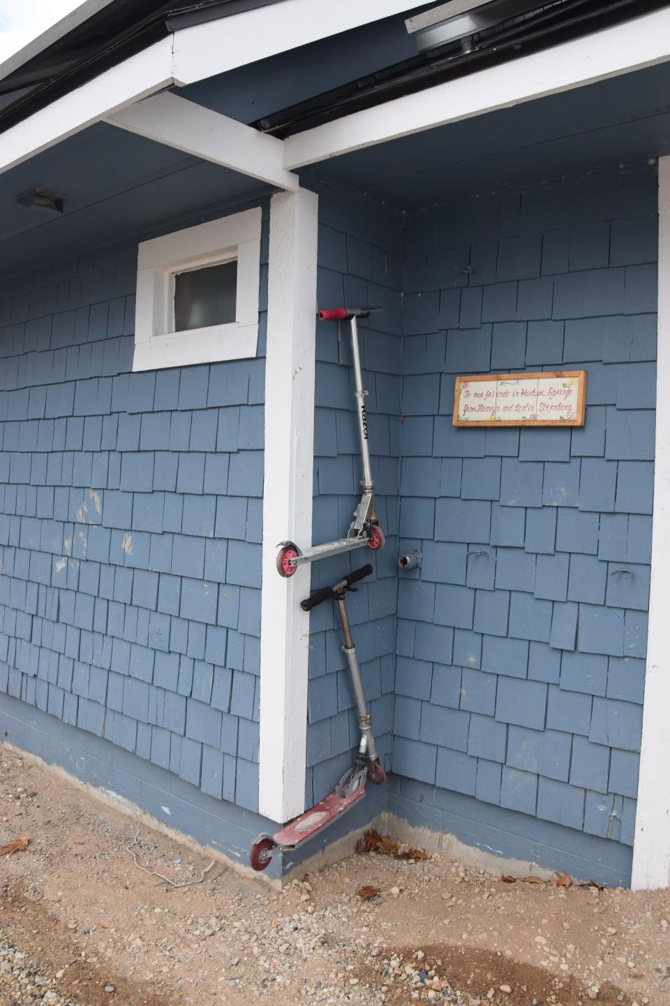 Scooters hang on a wall at the Harbor Springs skatepark on Nov. 17, 2023.