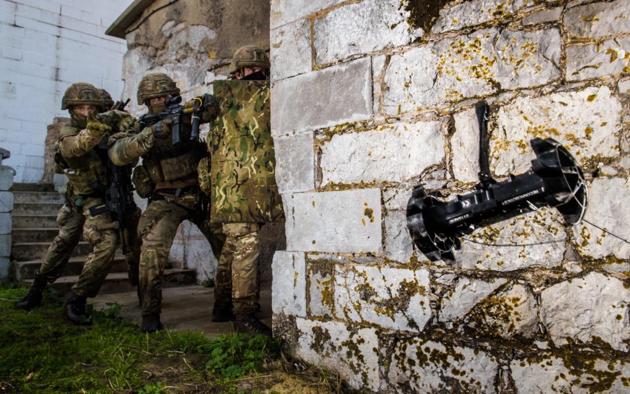 A Fire Team from P Squadron 43 Commando Royal Marines throws a 'throwbot' during Exercise Serpent Rock in Gibraltar -  Anthony Upton