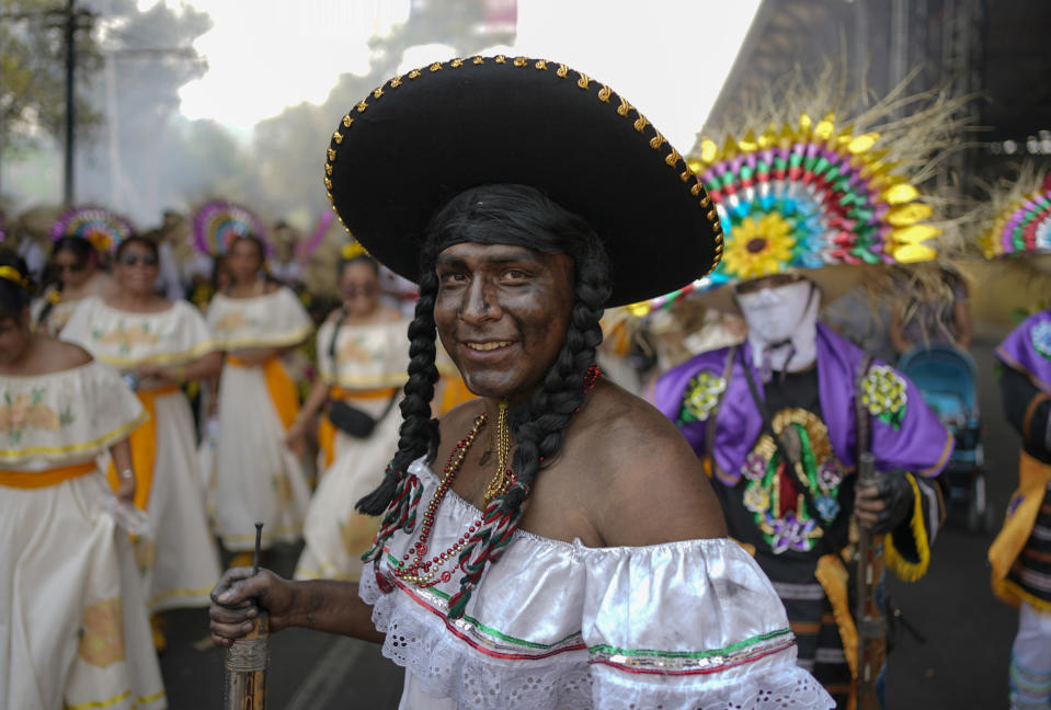 A person dressed as a woman fighter participates in a re-enactment of The Battle of Puebla as part of Cinco de Mayo celebrations in the Peñon de los Baños neighborhood of Mexico City, Thursday, May 5, 2022. Cinco de Mayo commemorates the victory of an ill-equipped Mexican army over French troops in Puebla on May 5, 1862. (AP Photo/Eduardo Verdugo)