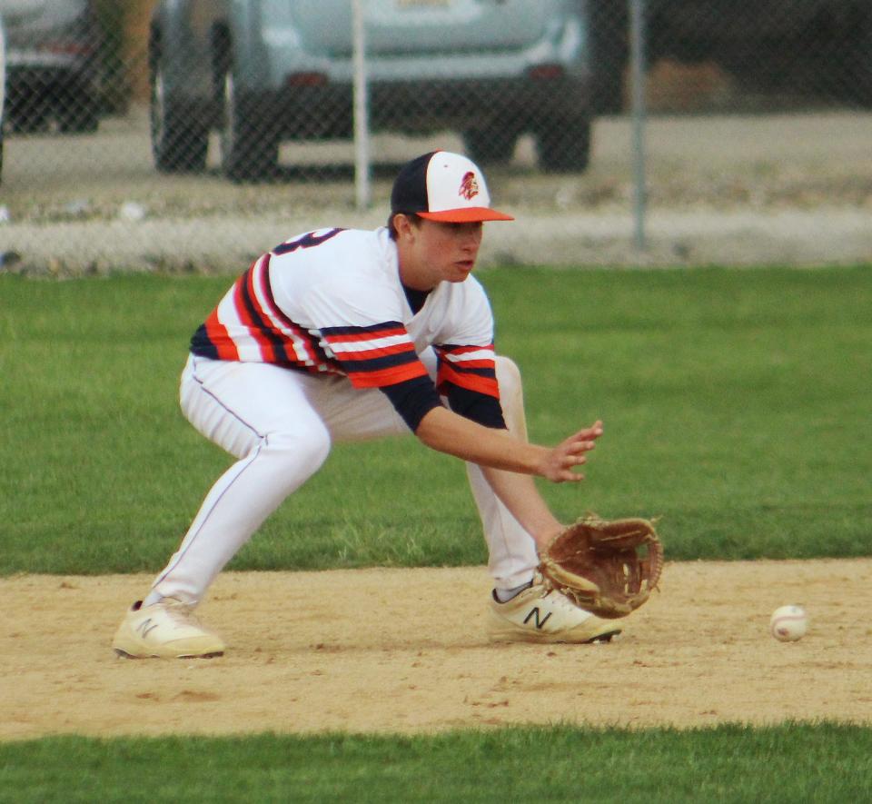 Pontiac second baseman Cayden Masching fields a grounder in the Indians' IPC baseball game with Monticello. The Tribe lost a 7-1 decision.