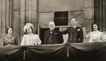 <p>Princess Elizabeth, Queen Elizabeth, Winston Churchill, King George VI, and Princess Margaret wave from the balcony of Buckingham Palace.</p>