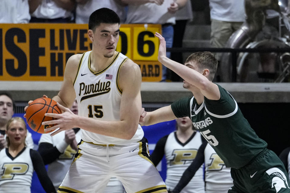 Michigan State center Carson Cooper (15) defends Purdue center Zach Edey (15) during the first half of an NCAA college basketball game in West Lafayette, Ind., Sunday, Jan. 29, 2023. (AP Photo/Michael Conroy)