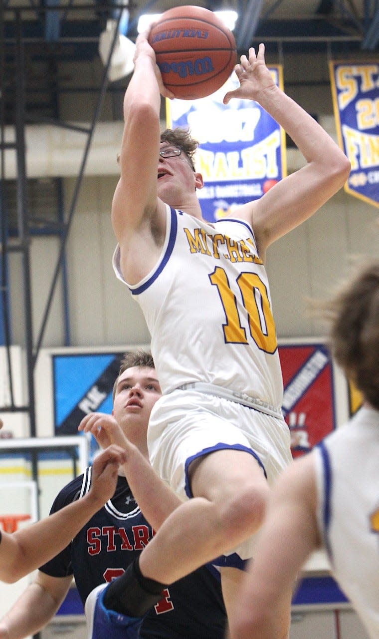 Mitchell senior Connor Fields curls down the lane to score against BNL Tuesday night. Fields had seven points and 13 rebounds.