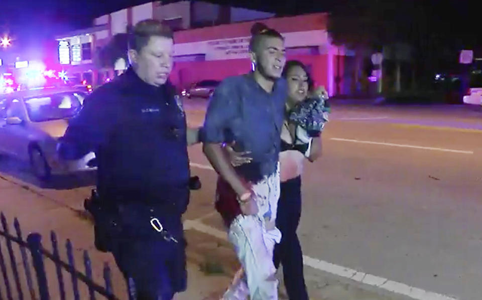 <p>An injured man is escorted out of the Pulse nightclub after a shooting rampage, Sunday morning June 12, 2016, in Orlando, Fla. (AP Photo/Steven Fernandez) </p>