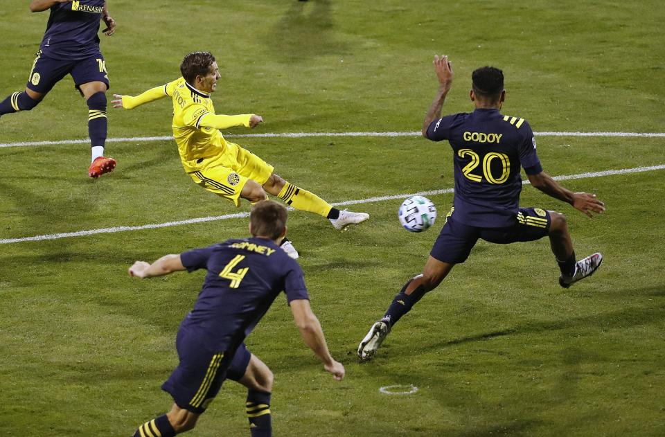 Columbus Crew SC forward Pedro Santos (7) scores a goal against Nashville SC midfielder Anibal Godoy (20) during the 2nd half of their MLS game at MAPFRE Stadium in Columbus, Ohio on September 19, 2020. [Kyle Robertson/Dispatch]