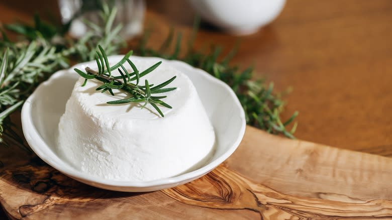 Ricotta on a plate garnished with rosemary